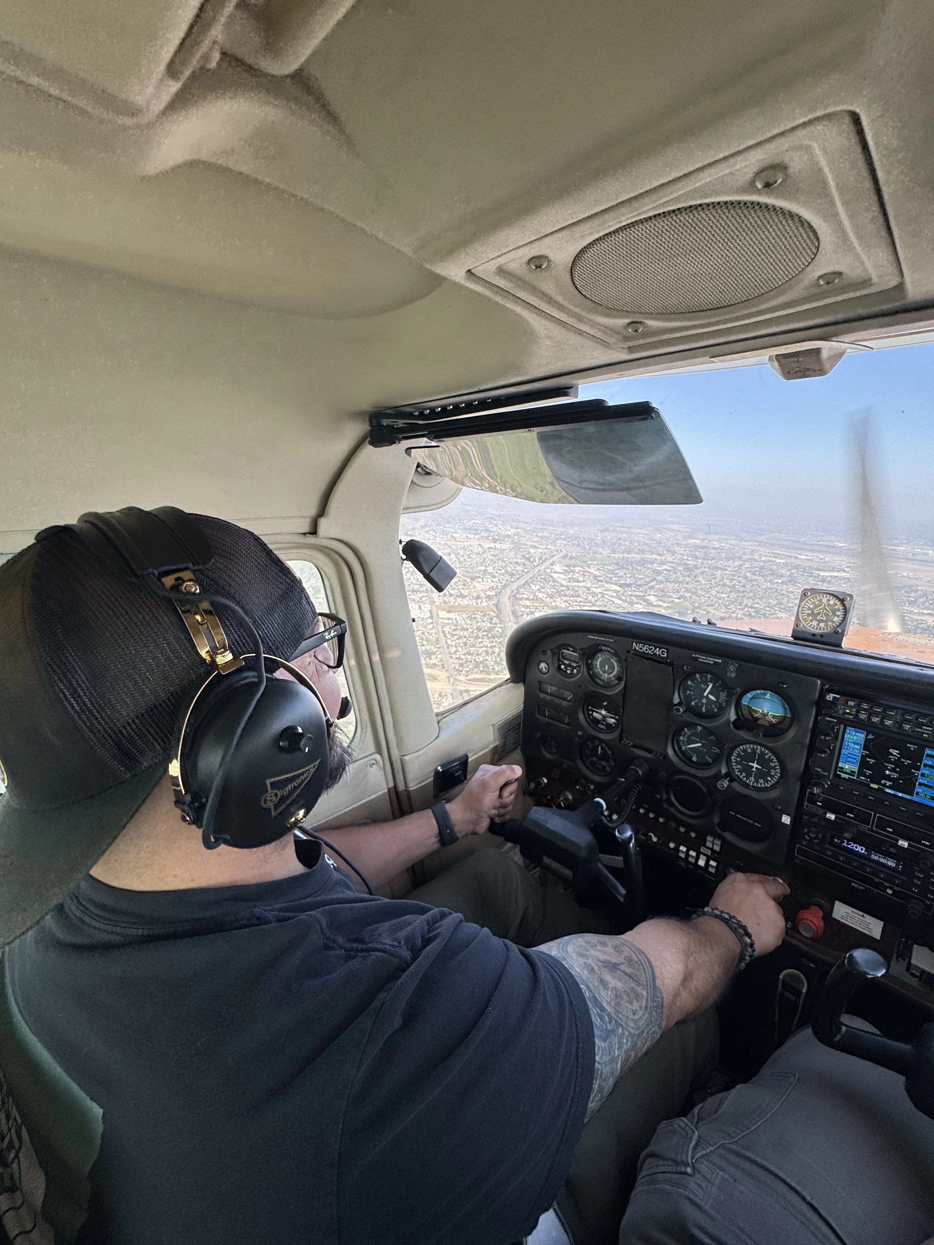 Instructor briefing a student in the cockpit